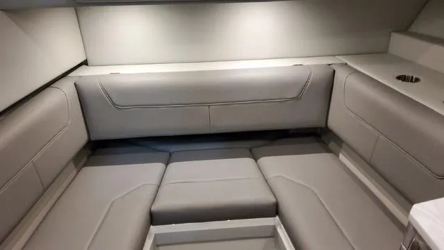 Slide: The Image of Interior seating area of 2023 Formula 380 SSC boat with gray upholstery. - 23