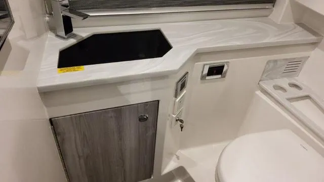 Slide: The Image of 2023 Formula 380 SSC bathroom with modern sink and storage cabinet. - 29