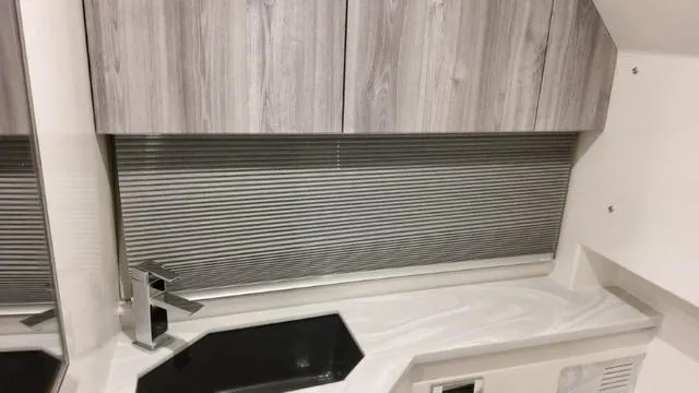 Slide: The Image of 2023 Formula 380 SSC interior, modern kitchen with sleek cabinetry and countertop. - 30