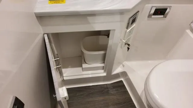 Slide: The Image of 2023 Formula 380 SSC bathroom cabinet with storage and modern fixtures. - 32