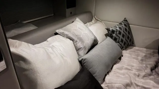 Slide: The Image of Interior cabin of 2023 Formula 380 SSC with plush pillows and bedding. - 34