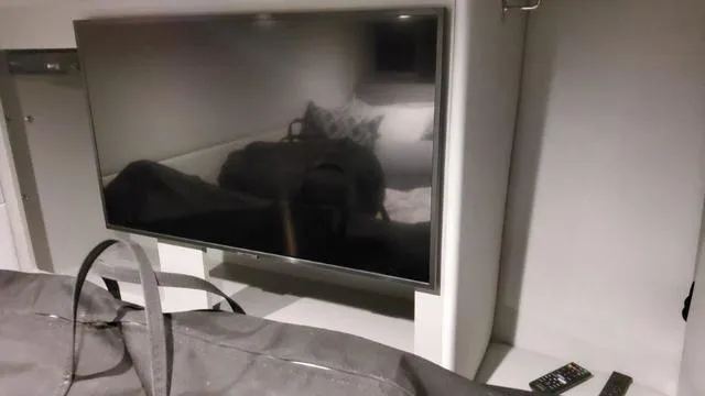 Slide: The Image of Flat-screen TV in the cabin of a 2023 Formula 380 SSC boat. - 36