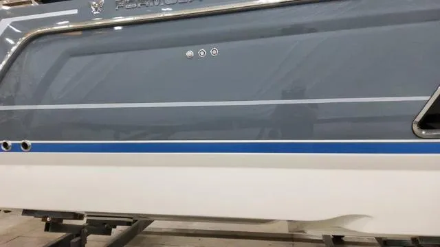 Slide: The Image of 2023 Formula 380 SSC boat side view with blue and white detailing. - 4