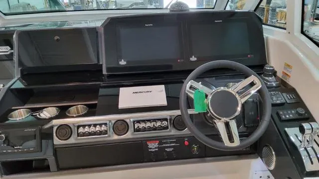 Slide: The Image of 2023 Formula 380 SSC helm with dual displays and modern controls. - 41