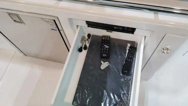 Slide: The Image of Drawer with remotes and keys in 2023 Formula 380 SSC boat. - 44
