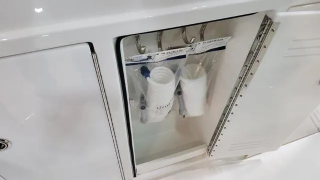 Slide: The Image of Open storage compartment on a 2023 Formula 380 SSC boat. - 47