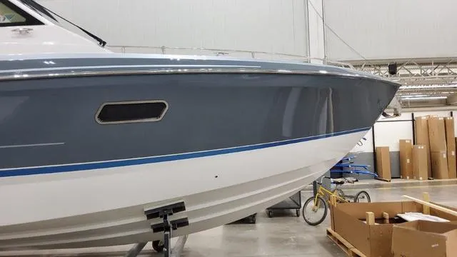 Slide: The Image of 2023 Formula 380 SSC boat in a warehouse, side view. - 6