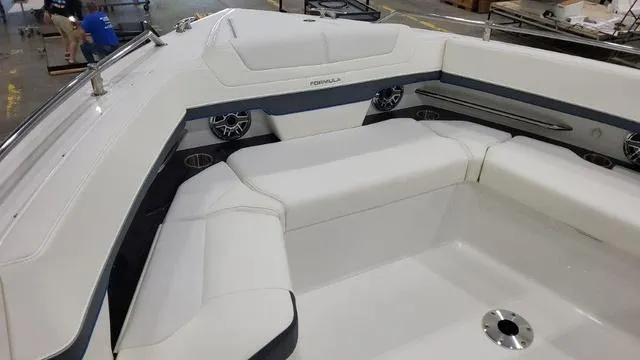 Slide: The Image of 2023 Formula 380 SSC boat interior with white seating and built-in speakers. - 9