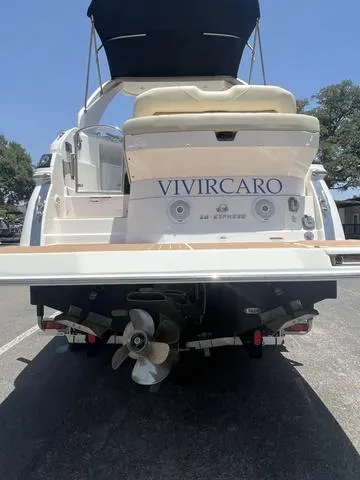Slide: The Image of 2019 Regal 28 Express boat, rear view with VIVIRCARO name. - 3