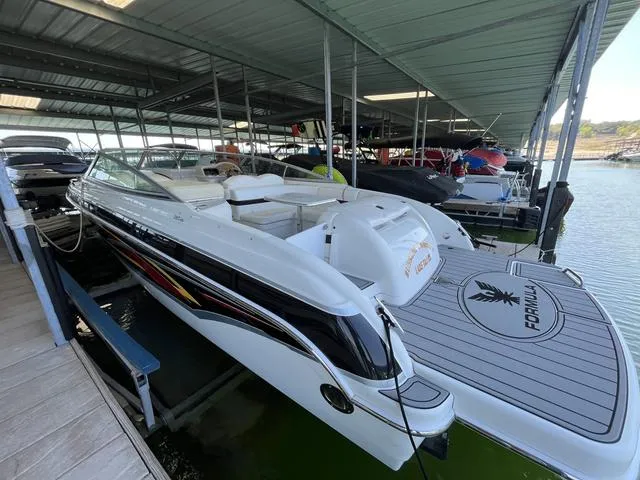 Slide: The Image of 2007 Formula Sun Sport 260 boat docked in a covered marina. - 1