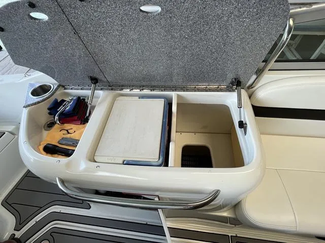 Slide: The Image of Open storage compartment on a 2007 Formula Sun Sport 260 boat. - 11
