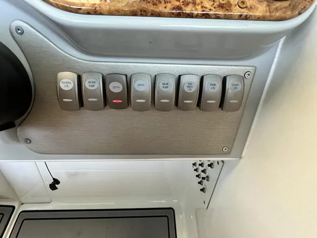 Slide: The Image of Control panel of a 2007 Formula Sun Sport 260 boat with labeled switches. - 12