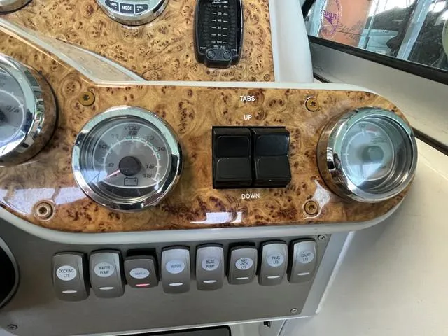 Slide: The Image of Dashboard of a 2007 Formula Sun Sport 260 boat with gauges and control switches. - 13