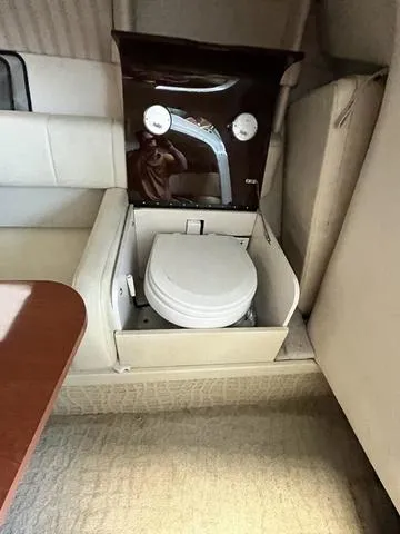 Slide: The Image of 2007 Formula Sun Sport 260 boat interior with built-in toilet. - 15