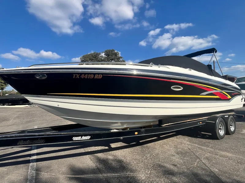 Slide: The Image of 2007 Formula Sun Sport 260 boat on trailer under blue sky. - 3