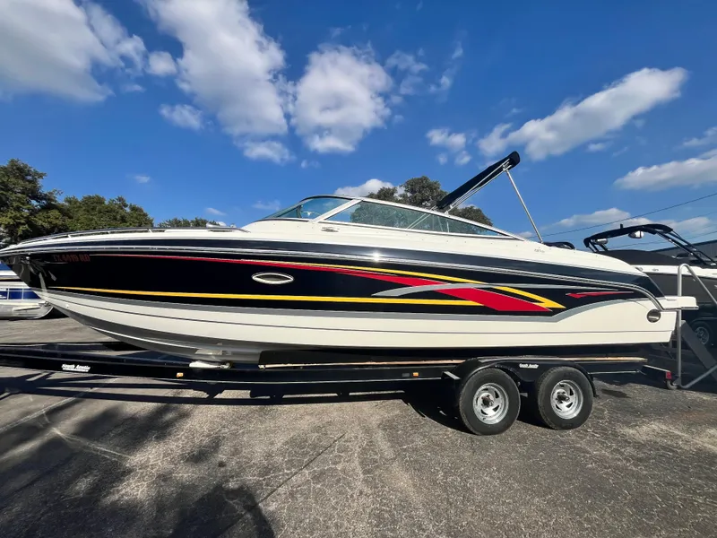 Slide: The Image of 2007 Formula Sun Sport 260 boat on trailer under blue sky. - 4