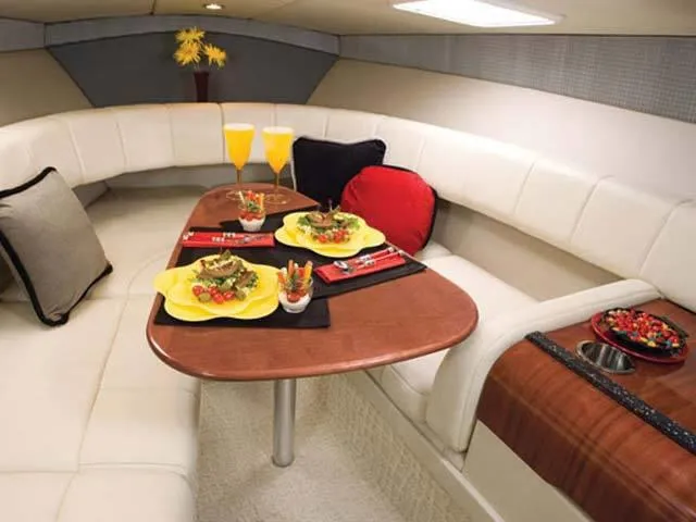 Slide: The Image of Luxurious interior of 2007 Formula Sun Sport 260 with dining setup. - 5