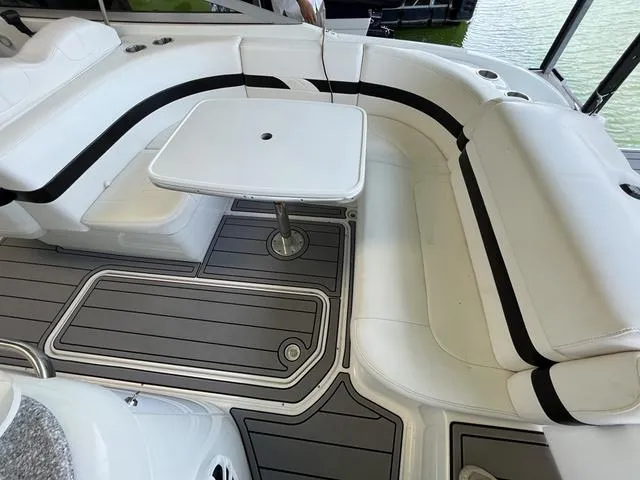 Slide: The Image of 2007 Formula Sun Sport 260 boat interior with white seating and table. - 7