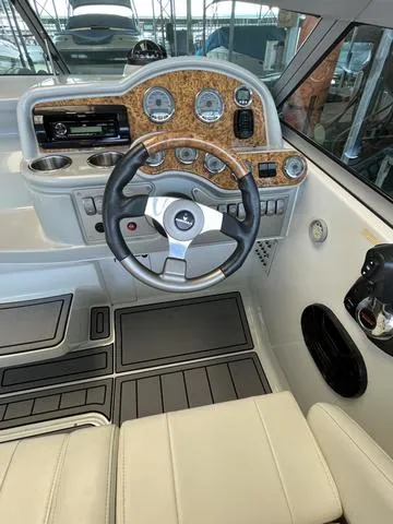 Slide: The Image of 2007 Formula Sun Sport 260 boat cockpit with steering wheel and dashboard. - 9