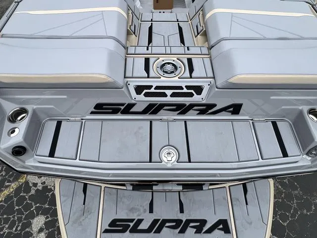 Slide: The Image of 2024 Supra SL 450 boat interior with gray seating and black accents. - 12