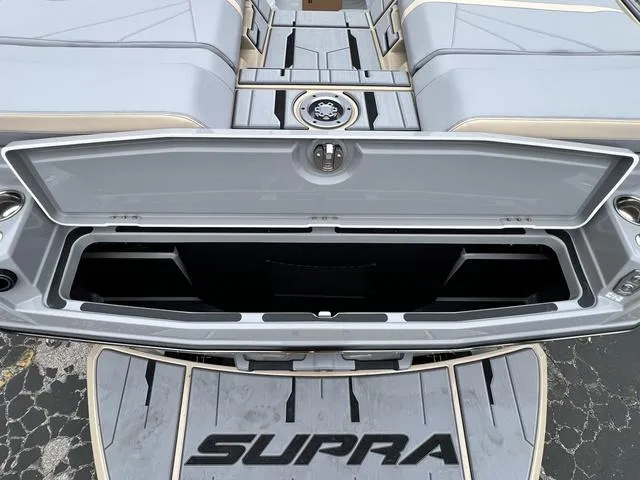 Slide: The Image of 2024 Supra SL 450 boat storage compartment and seating area. - 13