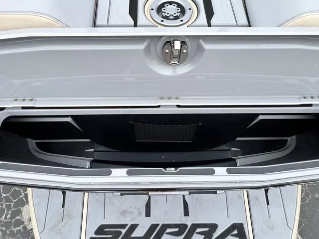 Slide: The Image of 2024 Supra SL 450 open storage compartment and deck. - 14