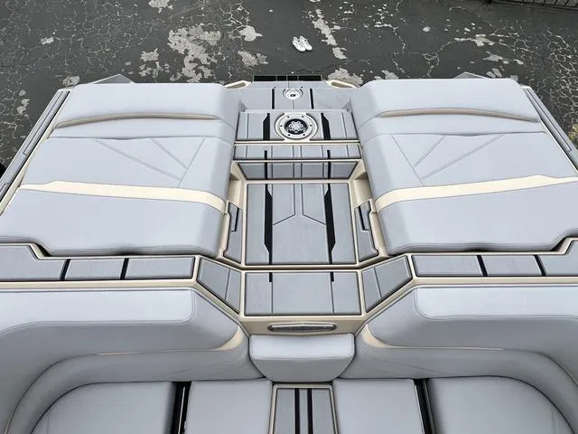 Slide: The Image of 2024 Supra SL 450 boat interior with sleek, modern seating and storage compartments. - 19