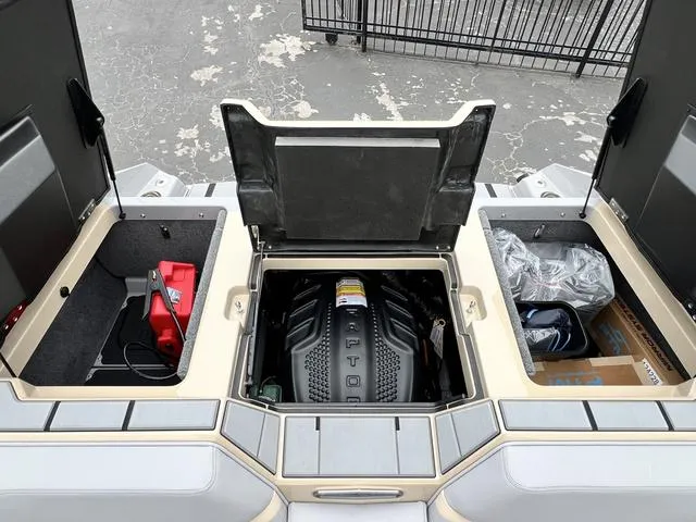 Slide: The Image of 2024 Supra SL 450 engine compartment with storage areas. - 21