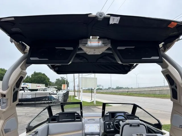 Slide: The Image of 2024 Supra SL 450 boat interior with advanced dashboard and overhead speakers. - 23