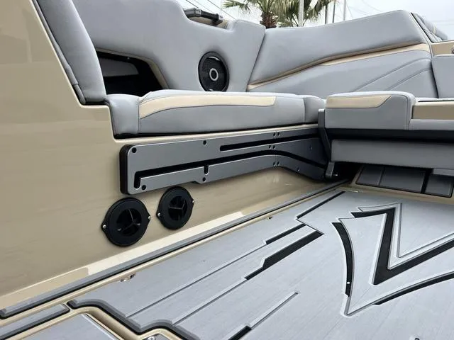 Slide: The Image of 2024 Supra SL 450 boat interior with gray seating and floor design. - 34