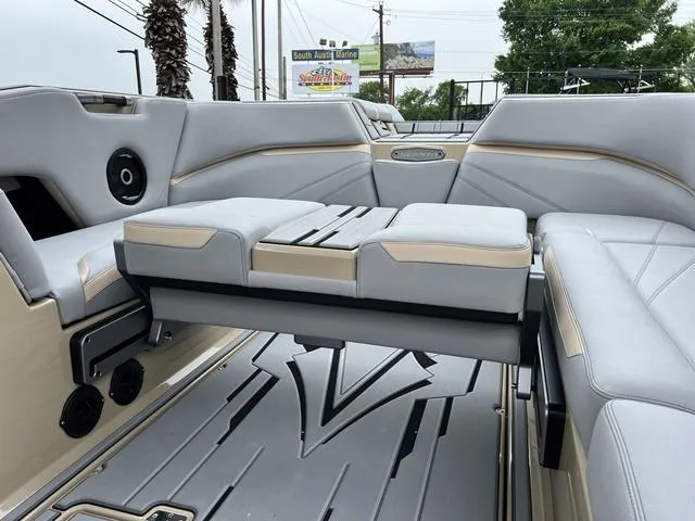Slide: The Image of 2024 Supra SL 450 boat interior with gray and beige seating. - 36