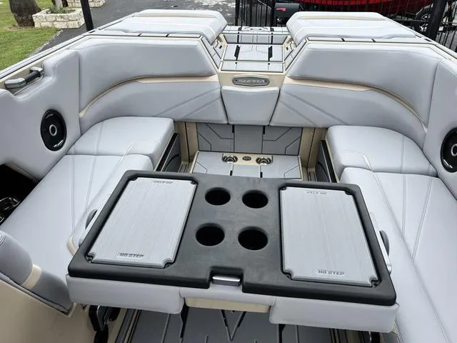 Slide: The Image of 2024 Supra SL 450 boat interior with seating and table. - 39