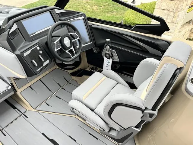 Slide: The Image of 2024 Supra SL 450 boat interior with modern dashboard and captain's chair. - 41