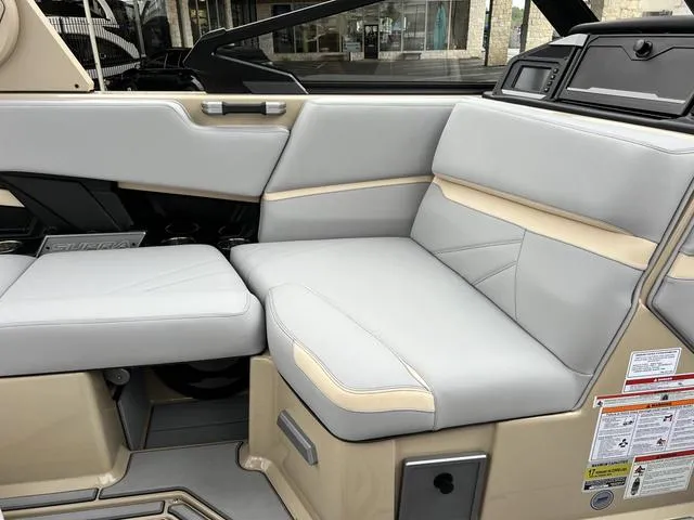 Slide: The Image of 2024 Supra SL 450 boat interior with beige and gray seating. - 46