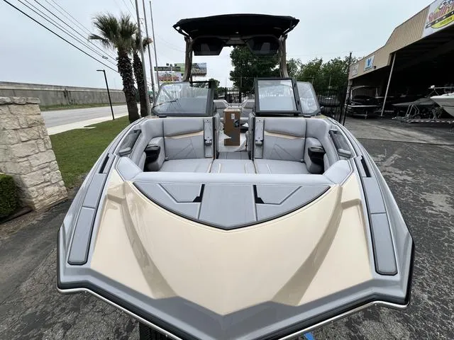 Slide: The Image of 2024 Supra SL 450 boat with luxurious seating and modern design. - 5