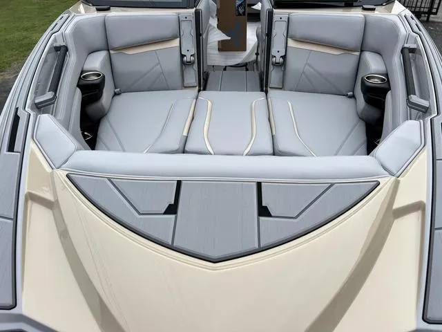 Slide: The Image of 2024 Supra SL 450 boat interior with luxurious seating and cup holders. - 6