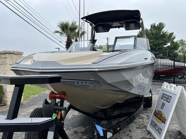 Slide: The Image of 2024 Supra SL 450 boat on trailer, displayed outdoors. - 7