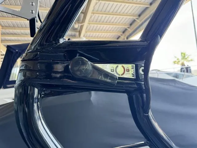 Slide: The Image of Close-up of 2024 Moomba Max boat's black metal frame and locking mechanism. - 10