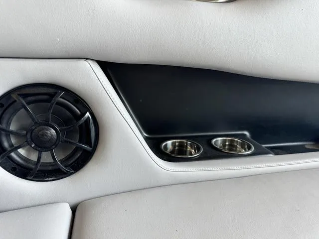 Slide: The Image of 2024 Moomba Max interior speaker and cup holders. - 9