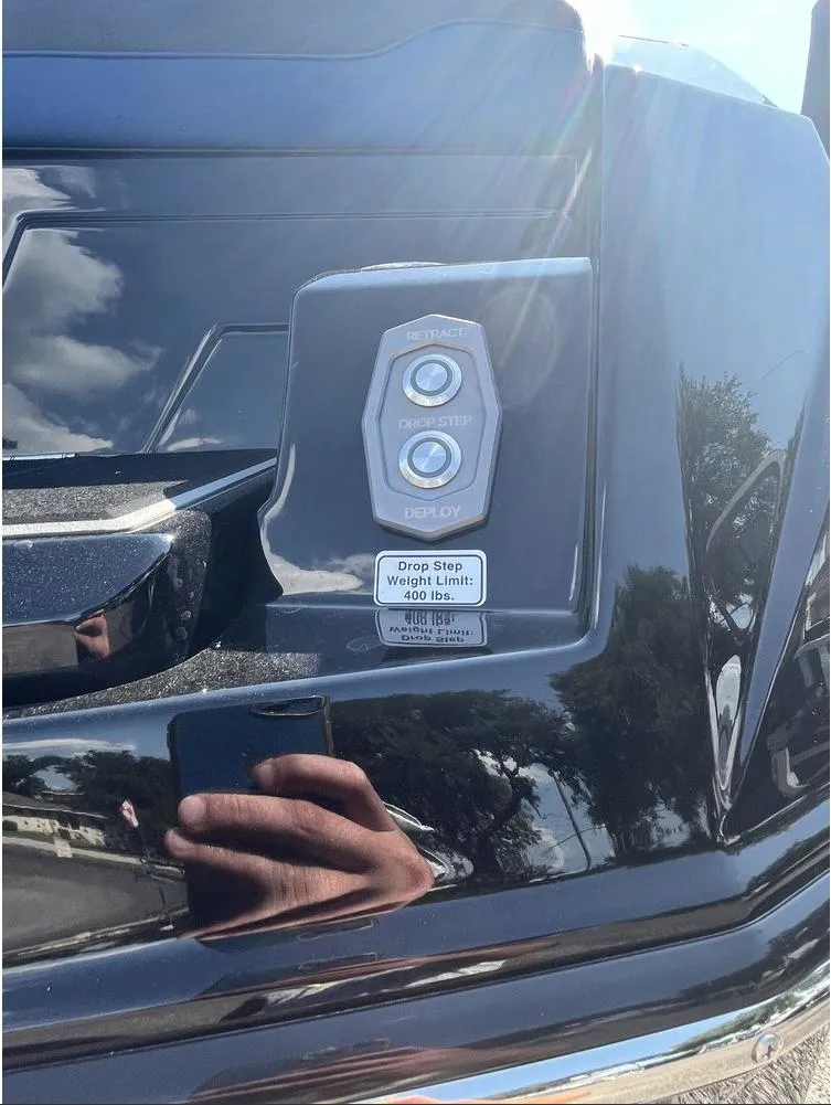 Slide: The Image of 2024 Supra SE 550 boat detail with dual buttons and weight limit label. - 11