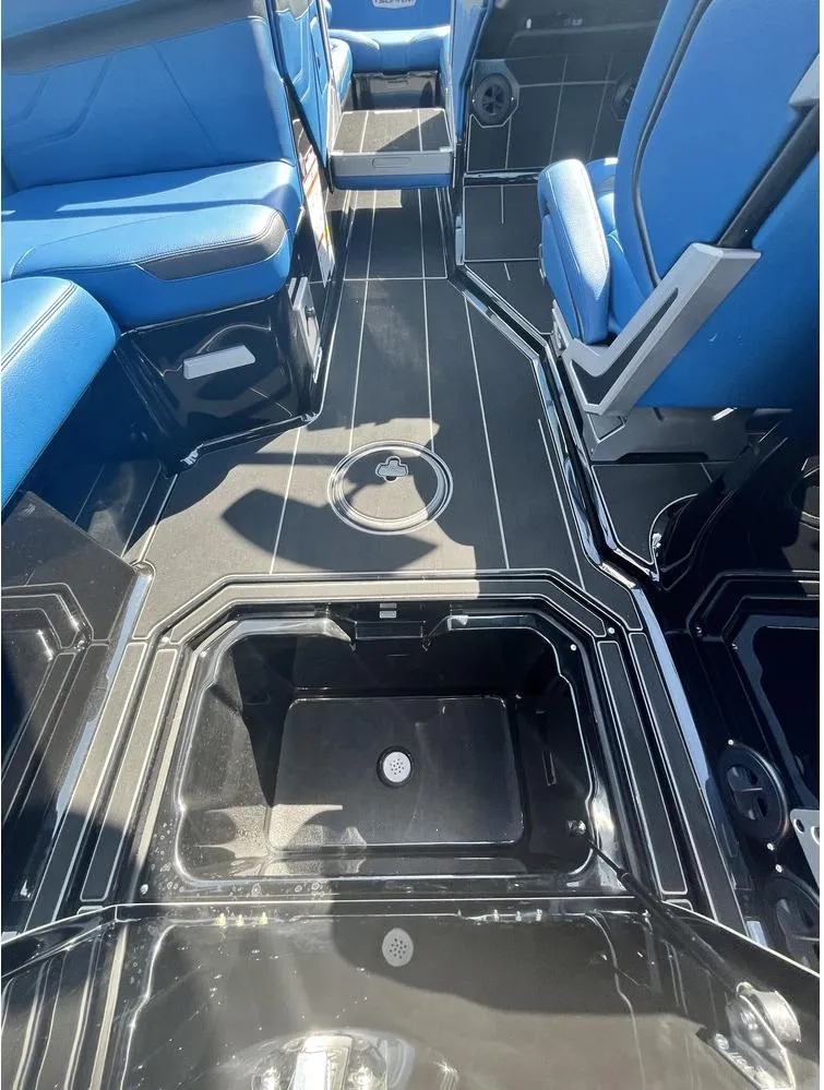 Slide: The Image of 2024 Supra SE 550 boat interior with blue seating and storage compartments. - 13