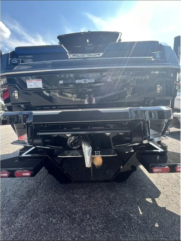 Slide: The Image of 2024 Supra SE 550 boat rear view in sunlight. - 14