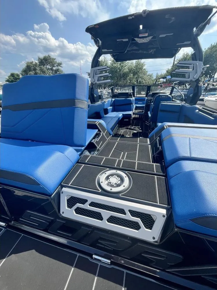 Slide: The Image of 2024 Supra SE 550 boat interior with blue seating and sleek design. - 15
