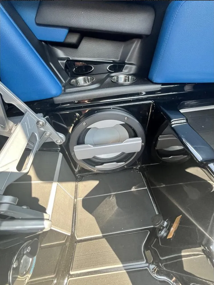 Slide: The Image of 2024 Supra SE 550 interior with speaker and cup holders. - 6