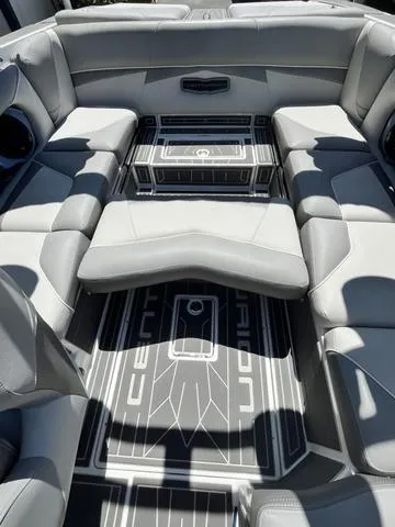 Slide: The Image of 2021 Centurion Fi 23 boat interior with gray seating and custom flooring. - 10