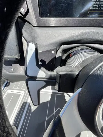 Slide: The Image of Close-up of 2021 Centurion Fi 23 boat steering wheel and controls. - 16