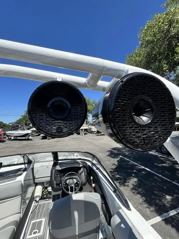 Slide: The Image of 2021 Centurion Fi 23 boat with tower speakers and interior view. - 8