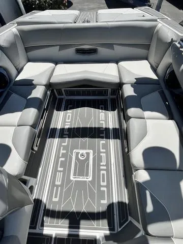 Slide: The Image of 2021 Centurion Fi 23 boat interior with spacious seating and branded flooring. - 9