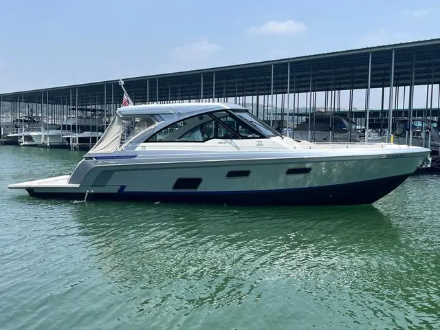 The Image of 2022 Formula 380 Super Sport Crossover boat docked in marina. - 1