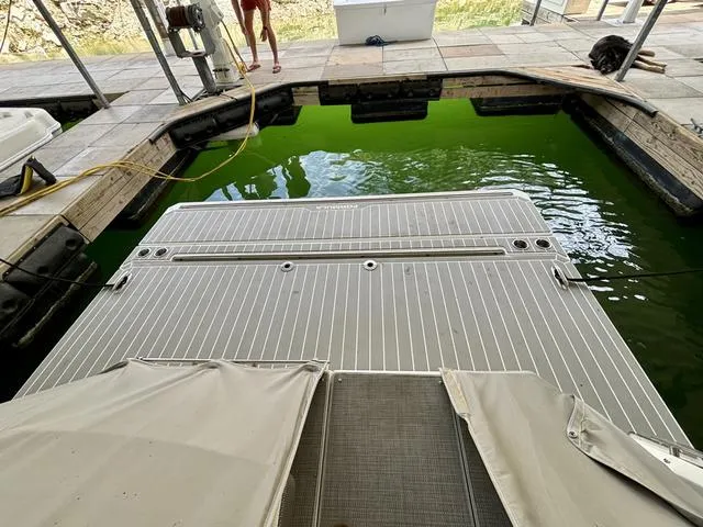 Slide: The Image of 2022 Formula 380 Super Sport Crossover docked with swim platform. - 17